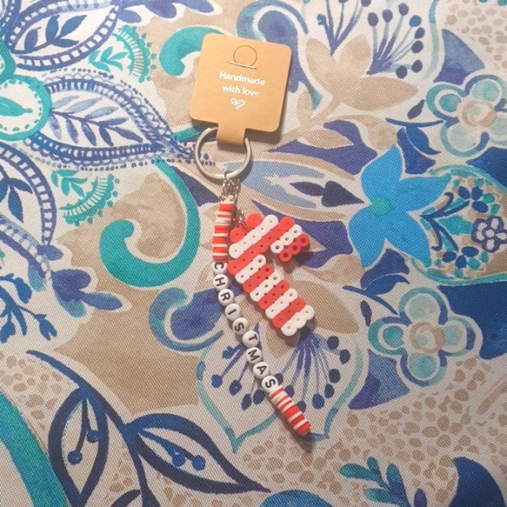 Viviana's handmade candy cane keychain and snowflake keychain